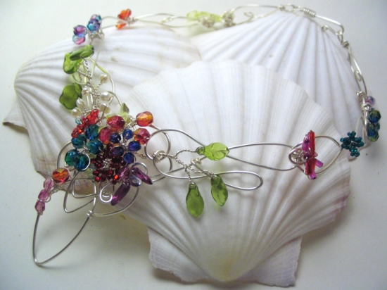 Celtic Garden A garden of hand-wired firepolished glass flowers on a celtic-inspired heavy silver wire base.